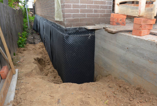 Happy homeowners after waterproofing job in Maribel